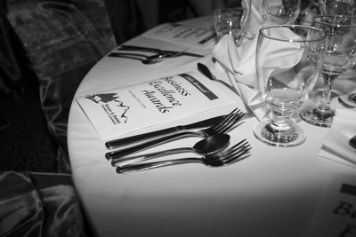 Black and white table setting at a corporate event