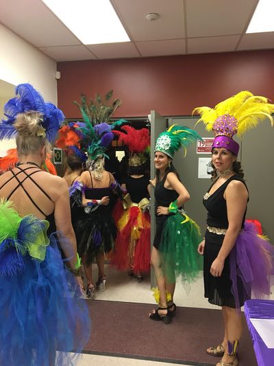 women celebrating with costumes at a community event