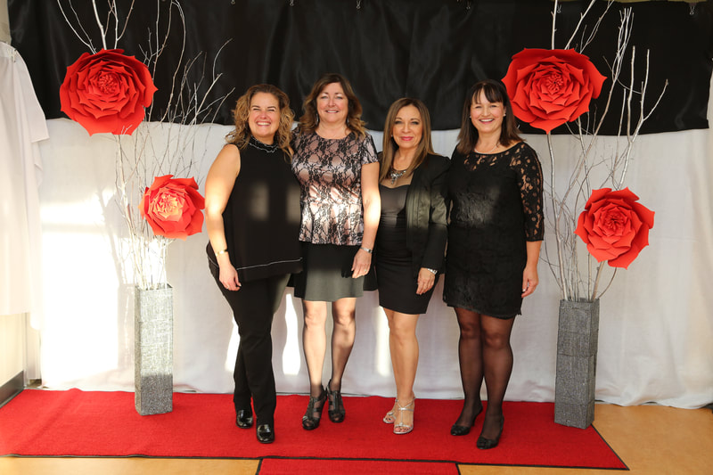 Terrace & District Chamber of Commerce Business Excellence Awards 2018 stage with women and roses