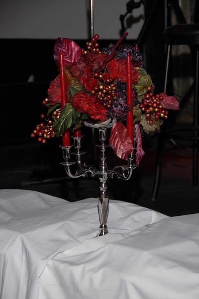 Red decorative table setting for a corporate event