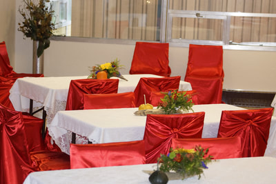 red and white table setting at private party