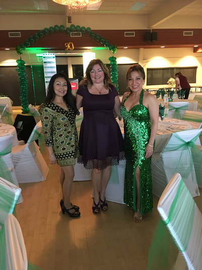 three women at a corporate event