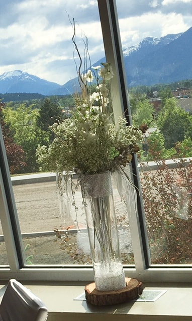 floral arrangement by window