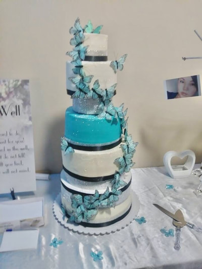 White and turquoise wedding cake in terrace BC