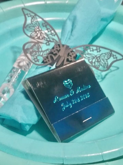 black and turquoise matchbook designed and provided by a wedding planner