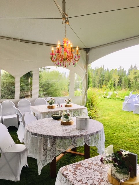 Outdoor tables with chandalier at a wedding in Terrace BC